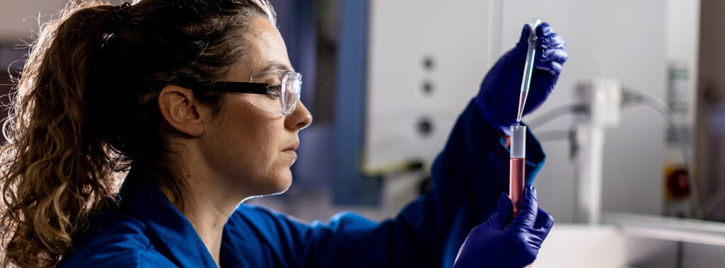 Scientist using a test tube