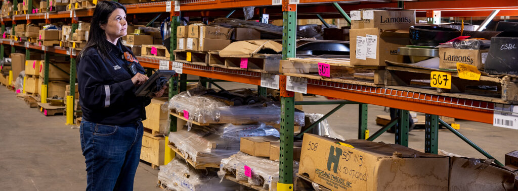 Warehouse worker looking at shelves