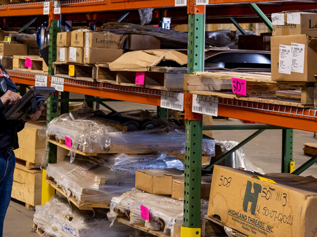 Warehouse worker looking at shelves