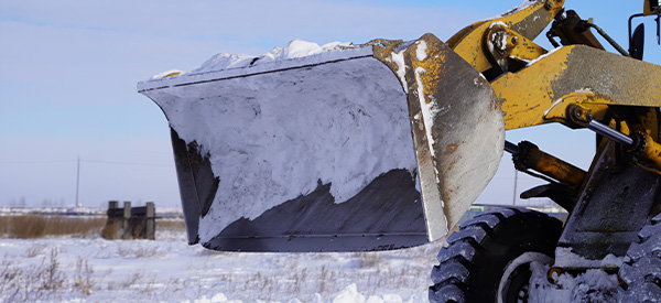 Image of a wheel loader with snow